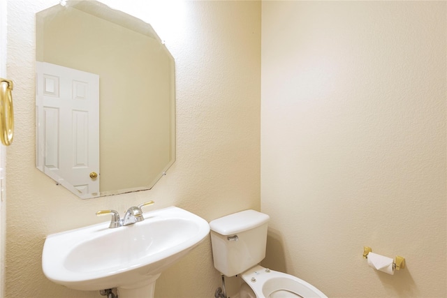 bathroom with sink and toilet