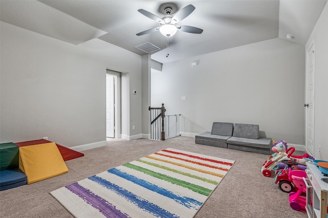 game room featuring ceiling fan, light carpet, and lofted ceiling