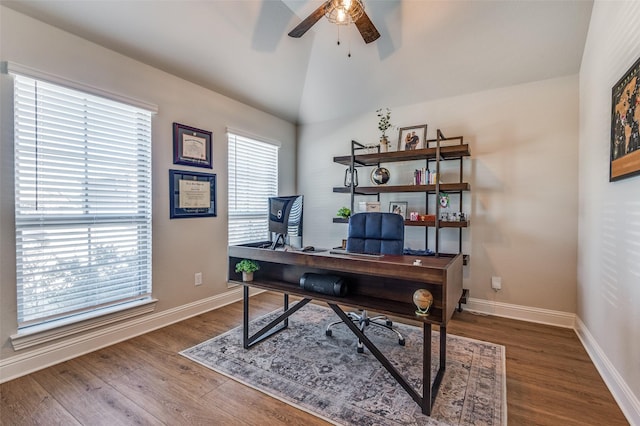 office space featuring vaulted ceiling, ceiling fan, and dark wood-type flooring