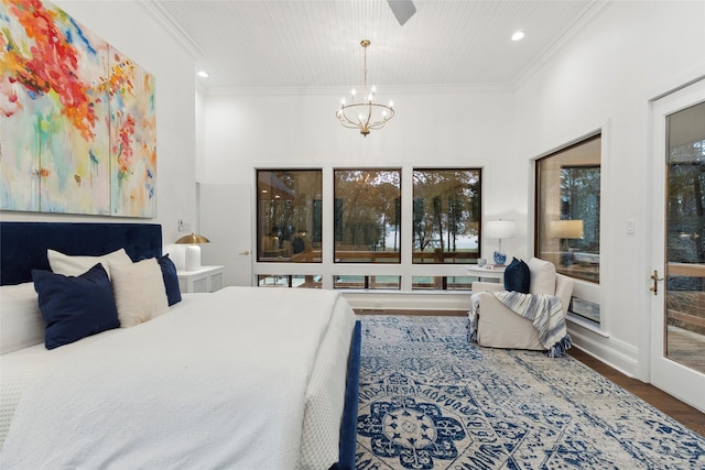 bedroom with access to exterior, dark hardwood / wood-style flooring, ornamental molding, and an inviting chandelier