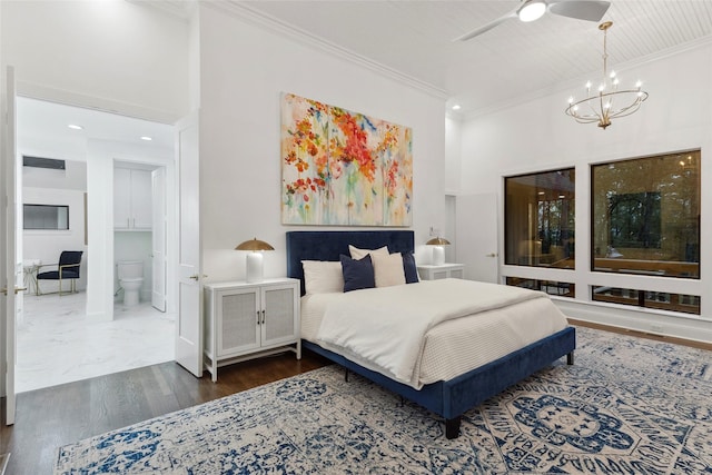 bedroom featuring ornamental molding, ceiling fan with notable chandelier, ensuite bathroom, and dark wood-type flooring