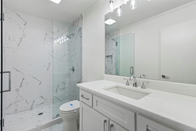 bathroom with vanity, toilet, a shower with door, and crown molding