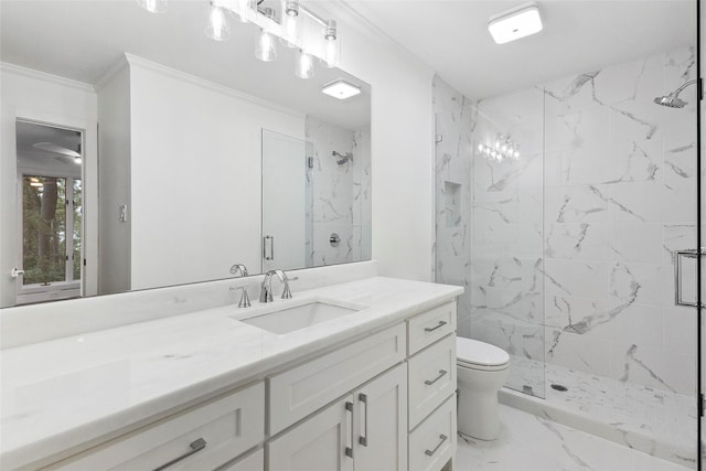 bathroom featuring vanity, toilet, a shower with door, and crown molding