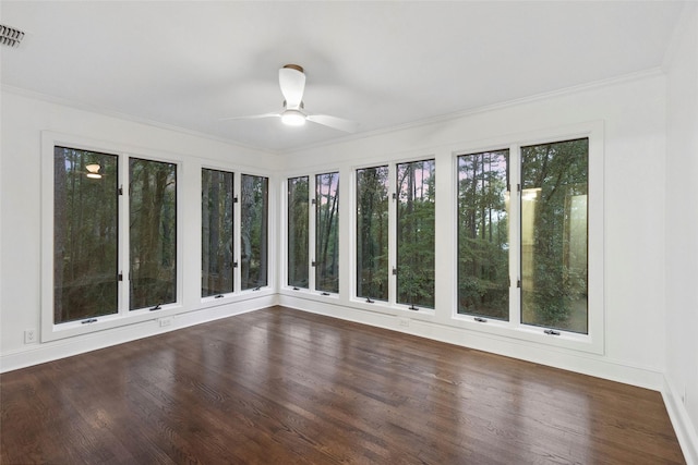 unfurnished sunroom with ceiling fan and a healthy amount of sunlight