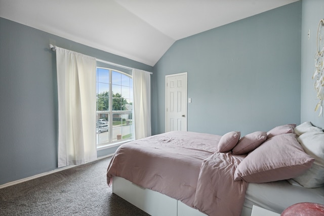 carpeted bedroom featuring lofted ceiling