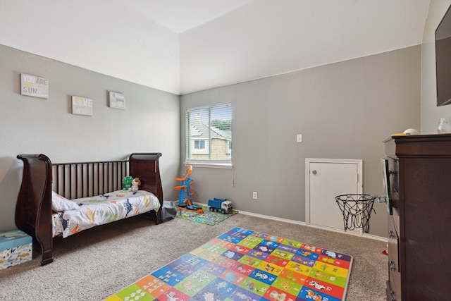 bedroom with carpet flooring and lofted ceiling