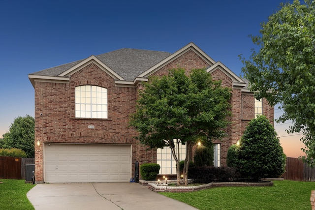 view of front facade featuring a yard and a garage