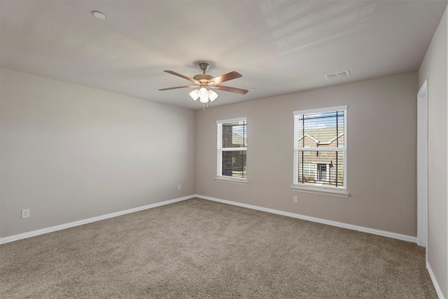 unfurnished room featuring carpet and ceiling fan