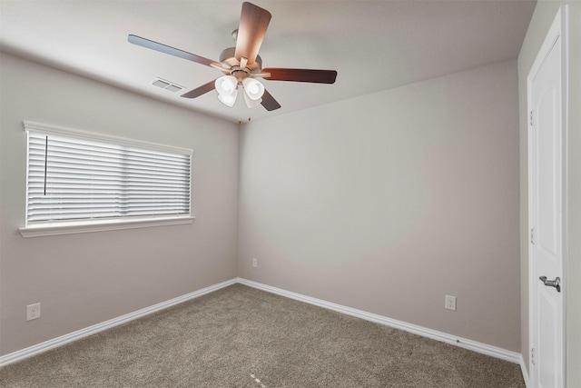 empty room featuring ceiling fan and carpet floors