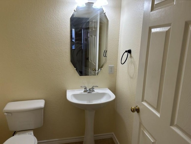 bathroom featuring toilet