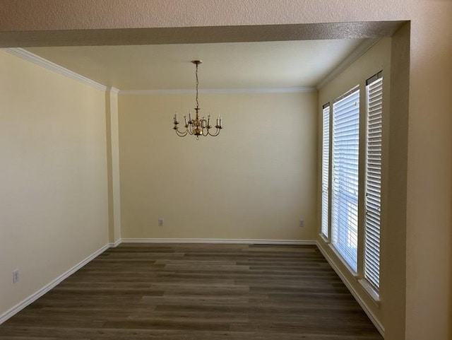 unfurnished dining area with ornamental molding, dark wood-type flooring, and a notable chandelier