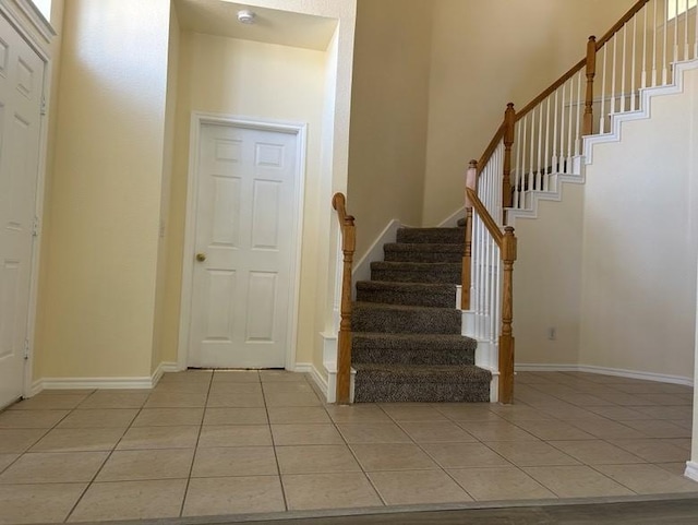 foyer entrance with light tile patterned floors