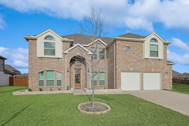 view of front of home with a garage and a front lawn