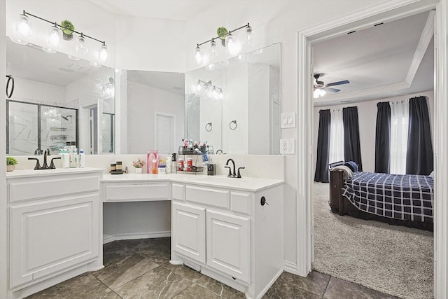 bathroom featuring ceiling fan, vanity, and a shower with door