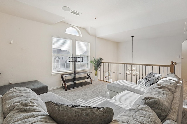 living room with vaulted ceiling, an inviting chandelier, and carpet flooring