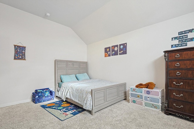 carpeted bedroom featuring vaulted ceiling