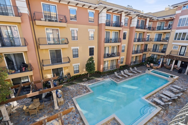 view of pool featuring a pool with connected hot tub