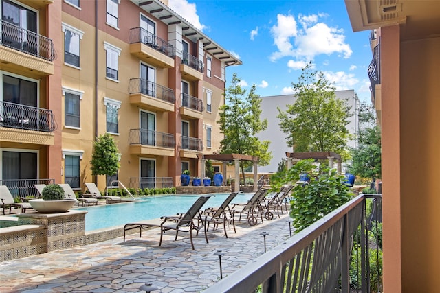 view of pool featuring pool water feature