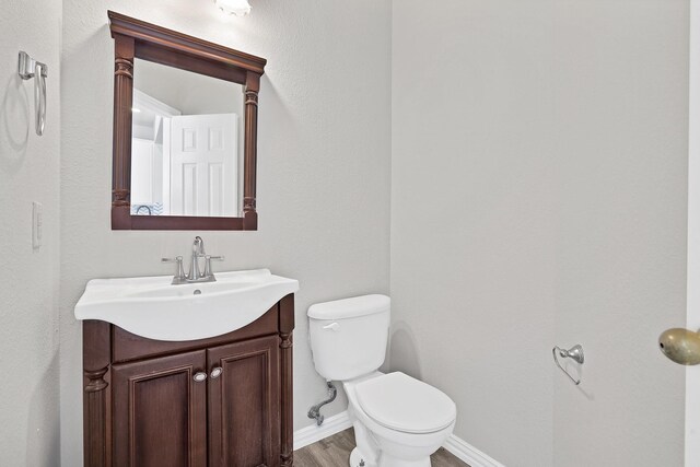 washroom with electric dryer hookup, plenty of natural light, cabinets, and dark hardwood / wood-style flooring