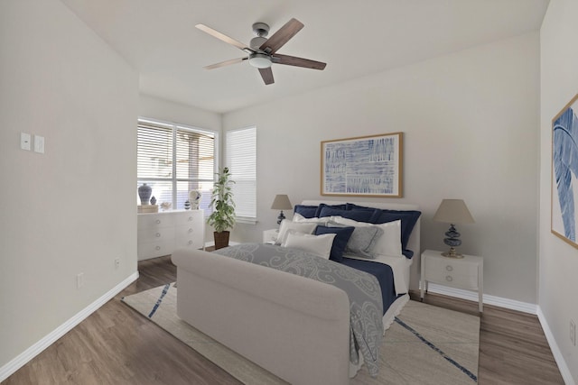 bedroom featuring hardwood / wood-style flooring and ceiling fan