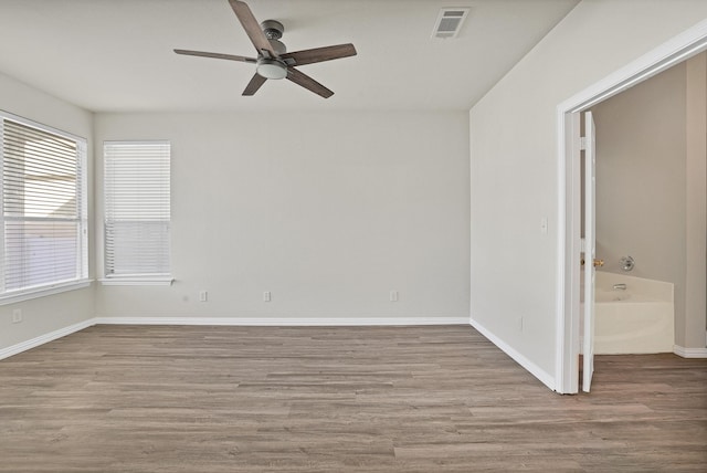 unfurnished room with ceiling fan and light hardwood / wood-style flooring