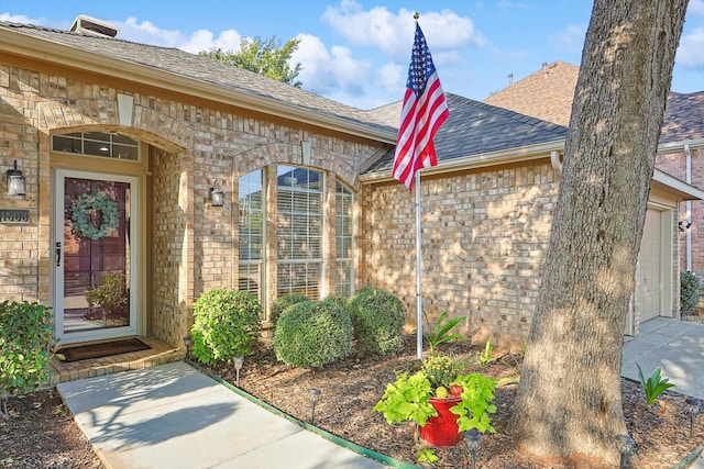 entrance to property featuring a garage