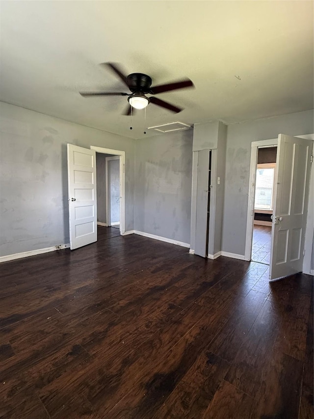 unfurnished room featuring ceiling fan and dark hardwood / wood-style floors