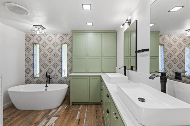 bathroom with a bathing tub and vanity