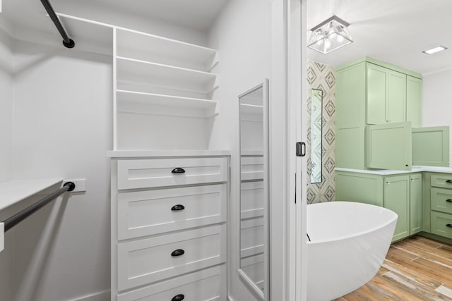 bathroom featuring a bathtub and wood-type flooring