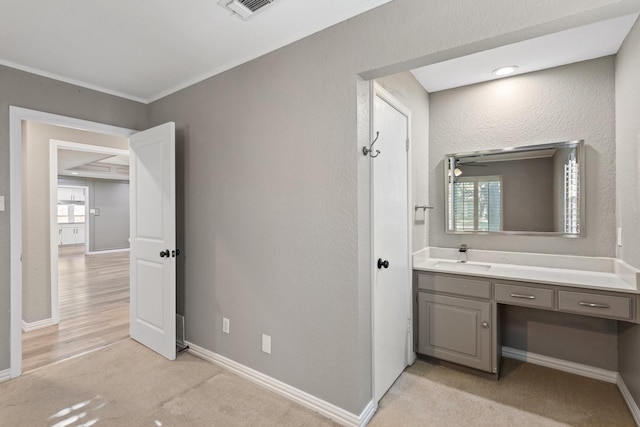 bathroom with vanity, plenty of natural light, crown molding, and ceiling fan