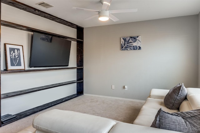 living room with ceiling fan and carpet flooring