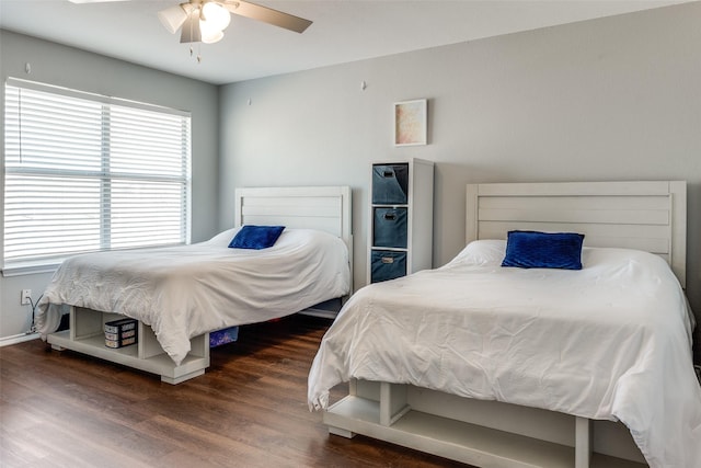 bedroom featuring dark hardwood / wood-style floors and ceiling fan