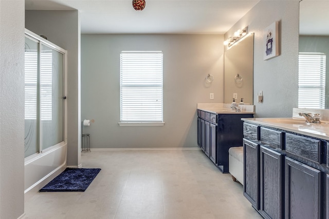 bathroom featuring two vanities and a sink