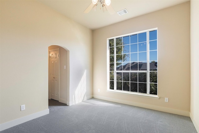 spare room featuring carpet floors and ceiling fan