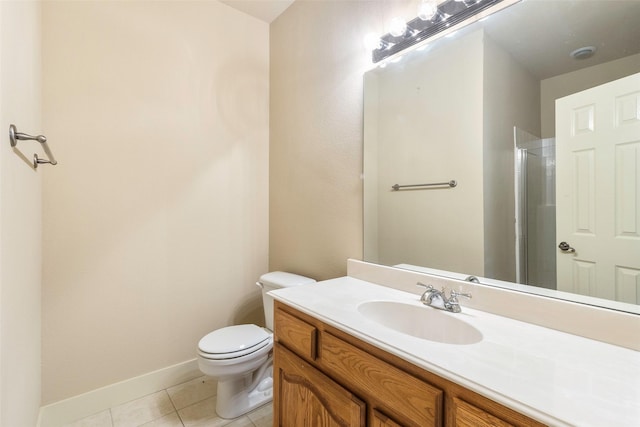 bathroom featuring vanity, toilet, and tile patterned floors