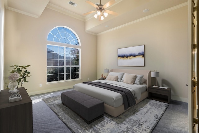 bedroom featuring ceiling fan, dark carpet, and crown molding