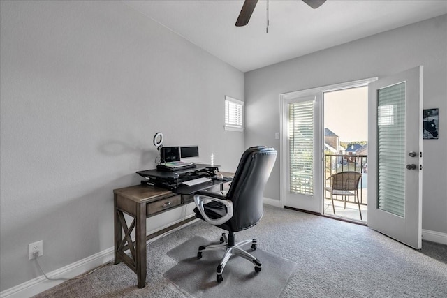 carpeted home office with ceiling fan