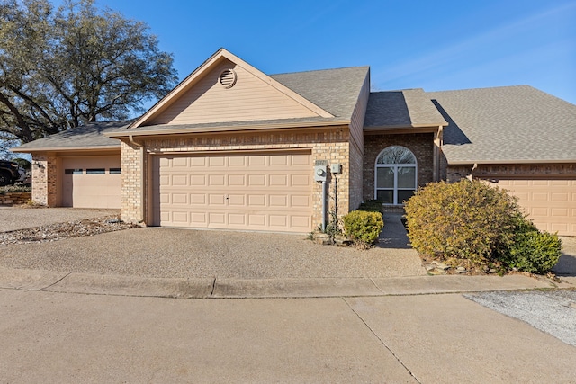 ranch-style house featuring a garage