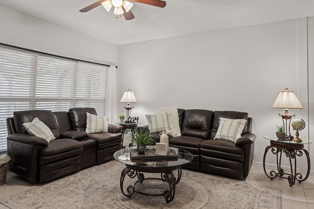 tiled living room with ceiling fan