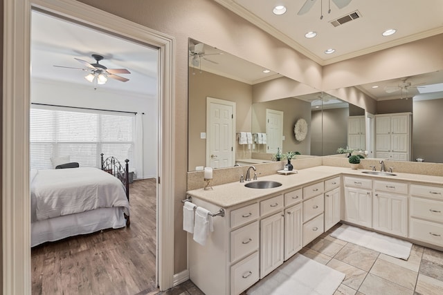 bathroom featuring vanity and ornamental molding