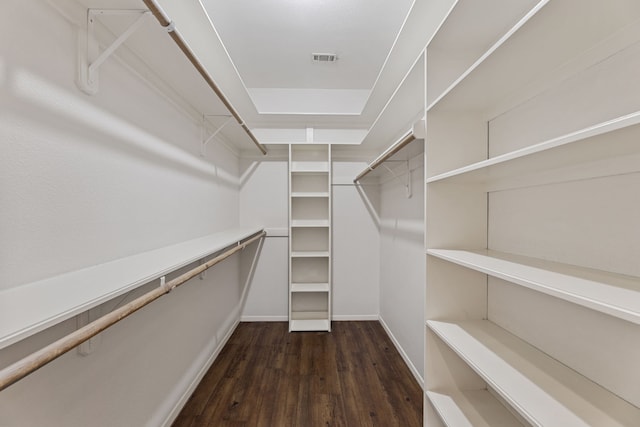 walk in closet featuring dark hardwood / wood-style floors