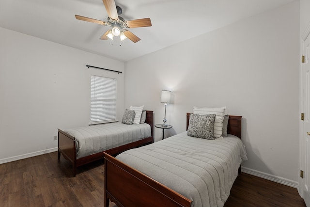 bedroom featuring dark hardwood / wood-style flooring and ceiling fan