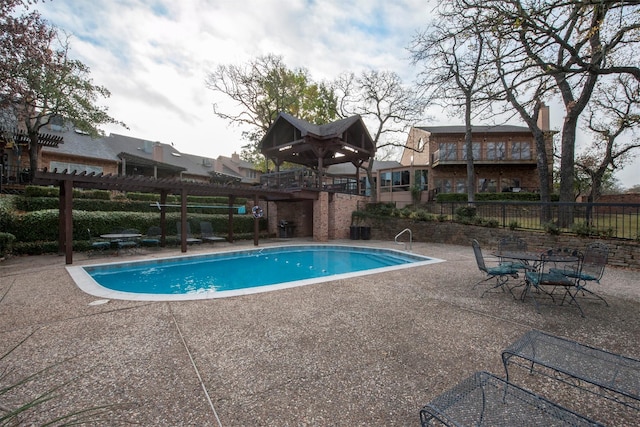 view of pool featuring a pergola and a patio