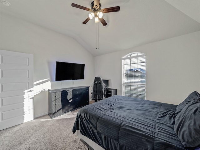 bedroom with ceiling fan, carpet floors, and lofted ceiling