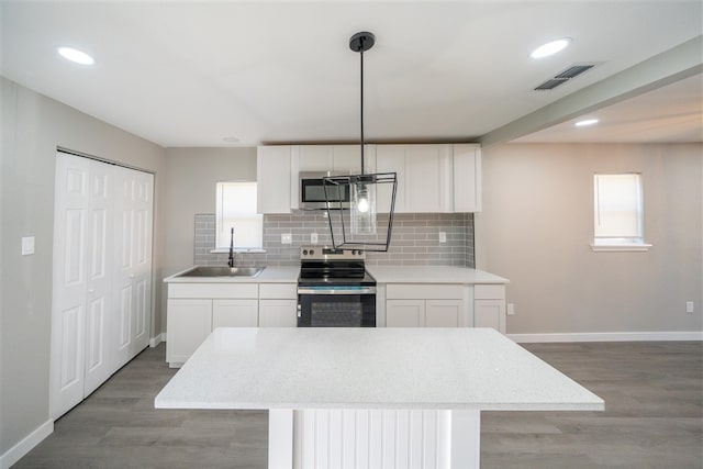 kitchen with white cabinets, stainless steel appliances, and sink