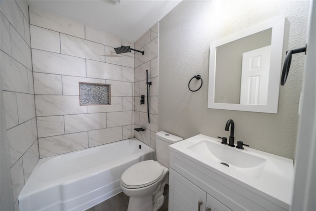 full bathroom with vanity, toilet, wood-type flooring, and tiled shower / bath