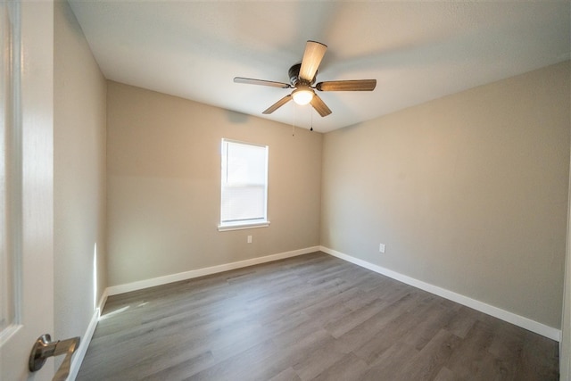 unfurnished room with hardwood / wood-style flooring and ceiling fan