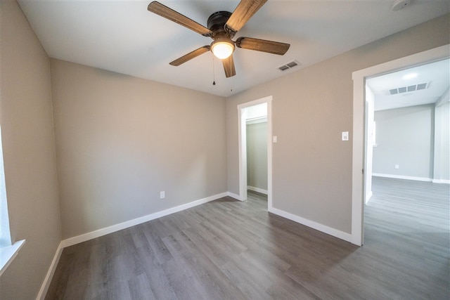 spare room featuring ceiling fan and wood-type flooring