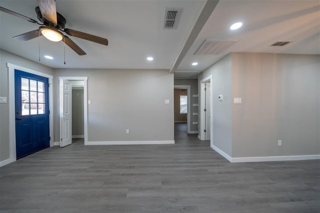 foyer entrance with hardwood / wood-style floors and ceiling fan