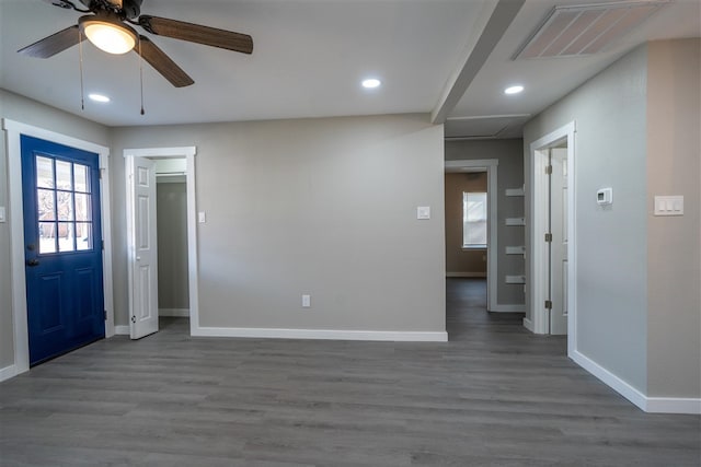 foyer entrance with dark hardwood / wood-style floors and ceiling fan